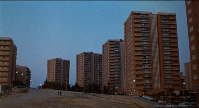 Modern housing overlooks the wasteland where Marcos (Vicente Parra) lives in Eloy de la Iglesia’s The Cannibal Man (1982)