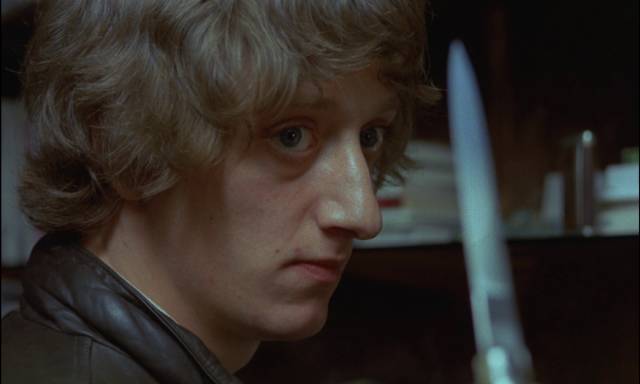 Drug dealer El Marqués (Enrique San Francisco) is threatened by El Jaro in Eloy de la Iglesia's Navajeros (1980)