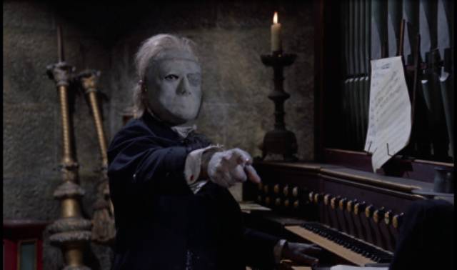 The Phantom (Herbert Lom) demands more effort from his unwilling student in Terence Fisher's The Phantom of the Opera (1962)