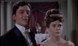 Opera producer Harry Hunter (Edward de Souza) rescues Christine (Heather Sears) from Lord Ambrose (Michael Gough) in Terence Fisher's The Phantom of the Opera (1962)