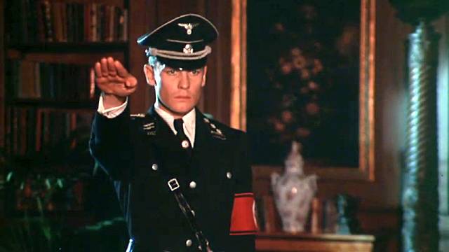 Martin (Helmut Berger)'s madness reaches its inevitable endpoint: as a dedicated SS officer serving the Reich in Luchino Visconti's The Damned (1969)