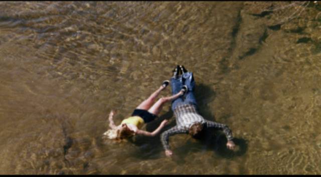 A killer's victims drift downstream in David Nelson's Death Screams (1982)