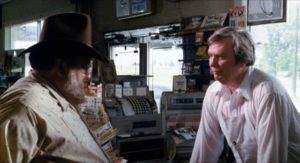 Sheriff Avery (William T. Hicks) stops at the local grocery for a chat in David Nelson's Death Screams (1982)