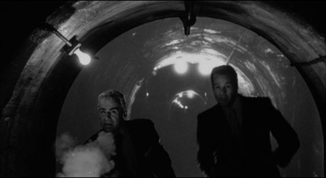 The investigation leads to a shootout in the sewers in Fred F. Sears' Chicago Syndicate (1955)