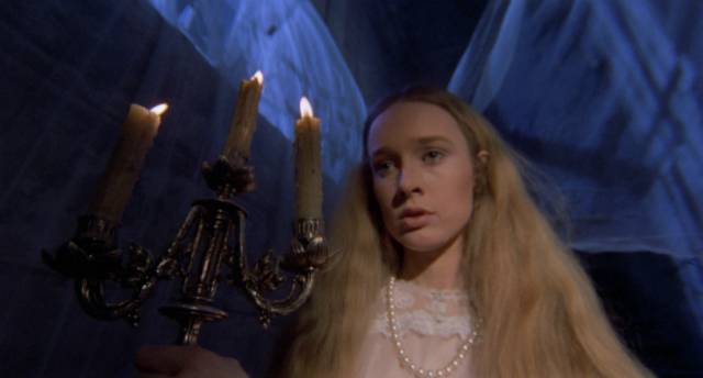 Jane (Camille Keaton) investigates noises from the cellar in Riccardo Freda's Tragic Ceremony (1972)