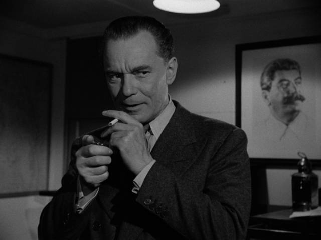 Alexi Laschenkov (Karel Stepanek) runs a spy network after scientific secrets in Alfred Werker's Walk East on Beacon (1952)