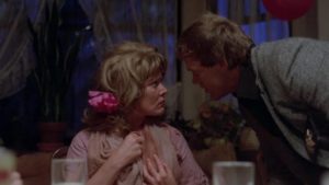 Detective Joe Carlson (Bo Svenson) doesn't believe Aunt Cheryl (Susan Tyrrell)'s story in William Asher's Butcher, Baker, Nightmare Maker (1982)