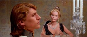 The Baroness (Monique van Vooren) is suspicious of the Baron's dinner guests in Paul Morrissey's Flesh for Frankenstein (1973)