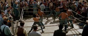 Newt (Kyle Johnson) and his friends are paid to fight at a local fairground in Gordon Parks' The Learning Tree (1969)