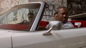 Caine (Tyrin Turner) and his friends on the look-out for trouble in the neighbourhood in the Hughes Brothers' Menace II Society (1993)