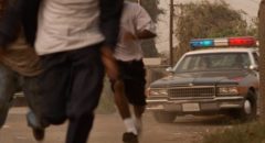 The police appear without warning in the Hughes Brothers' Menace II Society (1993)