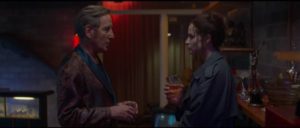 Enid Baines (Niamh Algar) visits the movie's sleazy producer (Michael Smiley) in Prana Bailey-Bond's Censor (2021)