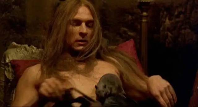 The Phantom (Julian Sands) gets intimate with his friends in Dario Argento's The Phantom of the Opera (1998)