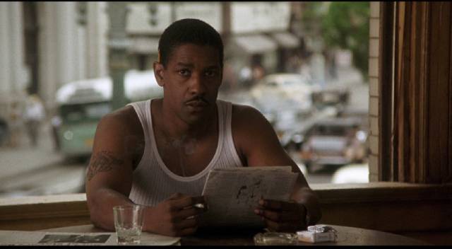 Easy Rawlins (Denzel Washington) scans the want ads in Carl Franklin's Devil in a Blue Dress (1995)