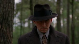 To prove his loyalty, Johnny Caspar (Jon Polito) demands that Tom Reagan (Gabriel Byrne) kill Bernie Bernbaum (John Turturro) in the Coen Brothers' Miller's Crossing (1990)