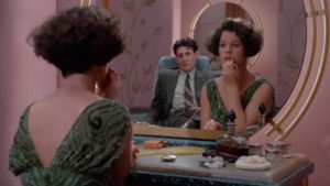 Tom Reagan (Gabriel Byrne) confronts Verna (Marcia Gay Harden) in the ladies' room in the Coen Brothers' Miller's Crossing (1990)