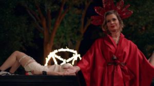 Rebecca Romijn presides over a demon-summoning in Chelsea Stardust's Satanic Panic (2019)