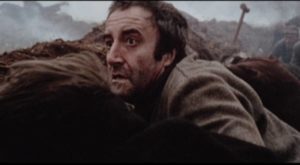Prisoner Rouquet (Peter Sellers) desperately seeks shelter from an air raid in Clive Rees' The Blockhouse (1973)