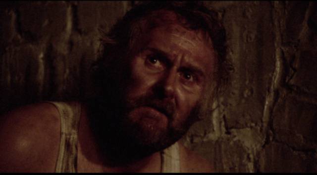 Aufret (Peter Vaughan) fears being punished if the Germans eventually rescue the trapped men in Clive Rees' The Blockhouse (1973)