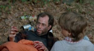 Young Glenn Randall (Eric Tonken) watches his father (Bernard Hocke) die slowly in Mik Cribben's Beware: Children at Play (1989)