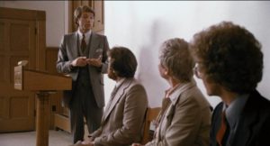 Author Steven Lessey (Stephen Young) tries to defend his trashy novels in Mario Azzopardi's Deadline (1980)