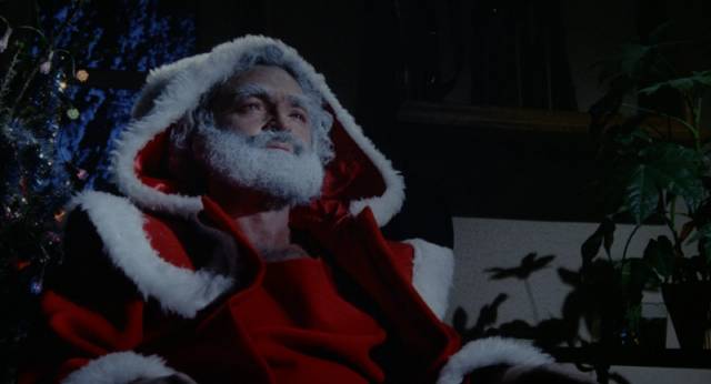 Creepy department store Santa (Patrick Floersheim) goes after his employer's young son in René Manzor's Deadly Games (1989)