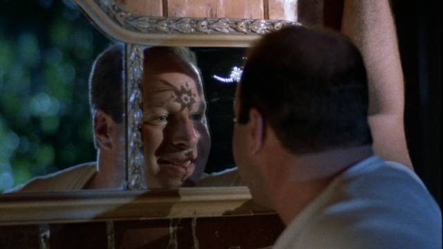 Kirk Smith (Nicholas Worth) tries to find himself in a mirror in Robert Hammer's Don't Answer the Phone! (1979)