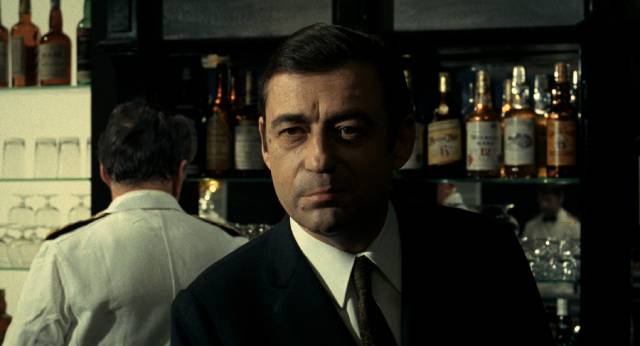 Nightclub owner Santi (François Périer) is crucial to the plan - and its failure in Jean-Pierre Melville's Le cercle rouge (1970)