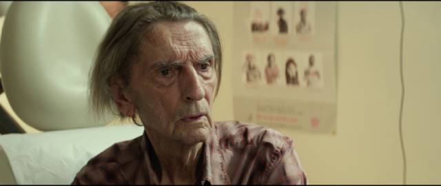 Lucky (Harry Dean Stanton) gets unsurprising news from his doctor: he's getting old in John Carroll Lynch's Lucky (2017)