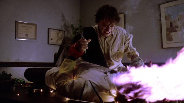 Sam (Brad Dourif) realizes they're out to get him and reacts in Tobe Hooper's Spontaneous Combustion (1990)