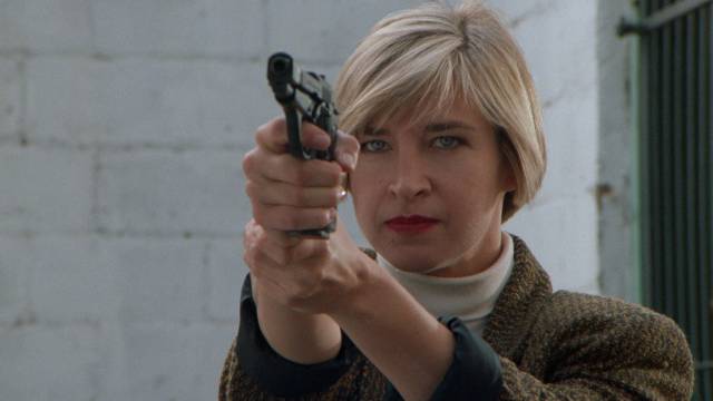 Detective Linda Masterson (Cynthia Rothrock) investigates a killer martial artist in Kelly Makin's Tiger Claws (1991)