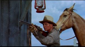 Cass (Richard Lapp) takes aim at the bank robbers who kidnapped Nellie Anne Randall) in Budd Boetticher's A Time for Dying (1969)