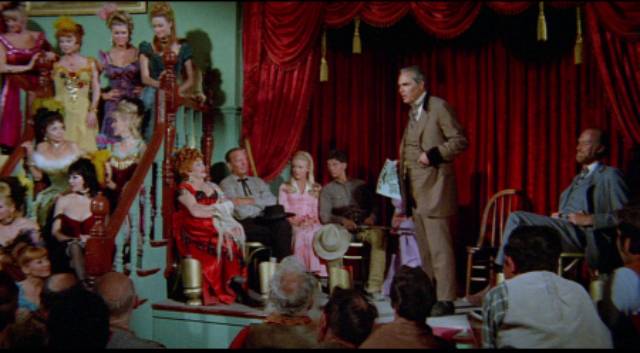 The mayor gives Cass (Richard Lapp) a reward for the dead robbers, setting him on his bounty hunter path in Budd Boetticher's A Time for Dying (1969)