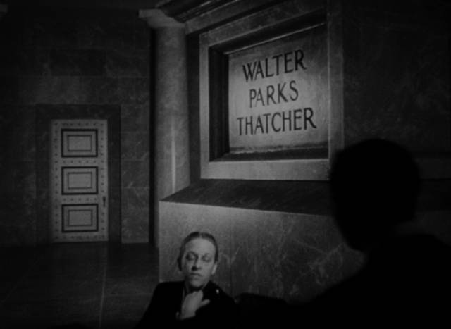 Reporter Thompson (William Alland) begins his quest with the banker's memoir in Orson Welles' Citizen Kane (1941)