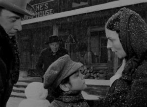 Mary Kane (Agnes Moorehead) tells young Charles Foster Kane (Buddy Swan) that he's going to live with banker Walter Parks Thatcher (George Coulouris) in Orson Welles' Citizen Kane (1941)