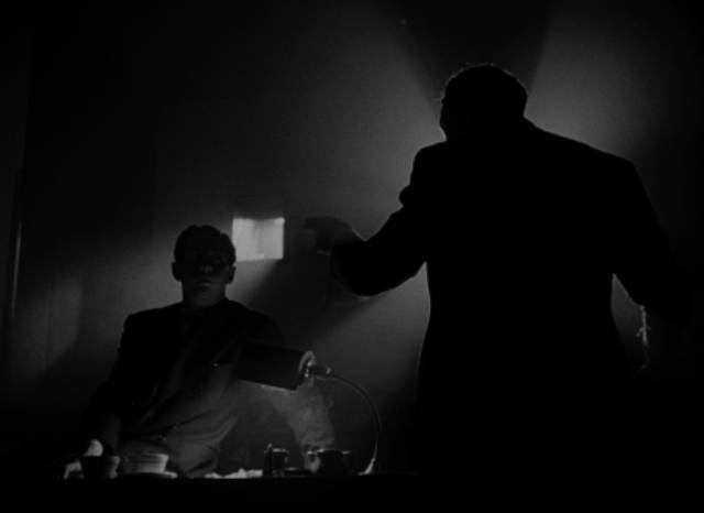The newsreel team discuss how to approach the dead tycoon's life in Orson Welles' Citizen Kane (1941)