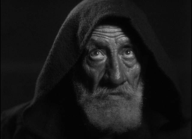 The Prior (Paco Martínez) tells a story which reflects their own lives in Fernando de Fuentes’ The Phantom of the Monastery (1934)