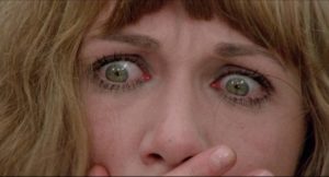 Dora Baldini (Daria Nicolodi) realizes there's something very wrong in Mario Bava's Shock (1977)