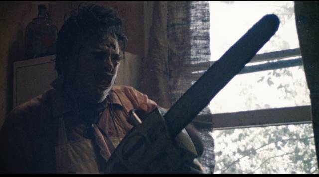 Leatherface (Gunnar Hansen) wields the tool of his trade in Tobe Hooper's The Texas Chain Saw Massacre (1974)
