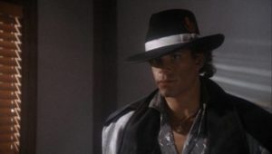 Lemro (Nicholas Hill) thinks he's a tough guy in Vik Rubenfeld's Alien Private Eye (1989)
