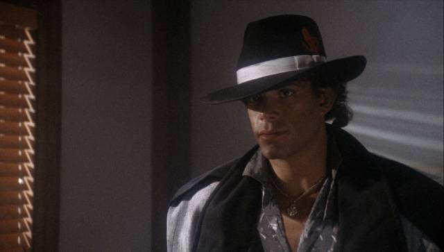 Lemro (Nicholas Hill) thinks he's a tough guy in Vik Rubenfeld's Alien Private Eye (1989)