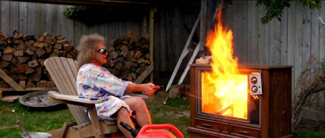 Cap'n Video (Ralph Zavadil) relaxes in the back yard in Jay Cheel's Beauty Day (2011)