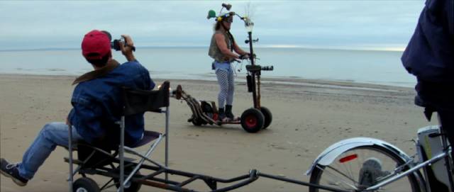 Cap'n Video (Ralph Zavadil) shooting the comeback special on his homemade scooter in Jay Cheel's Beauty Day (2011)