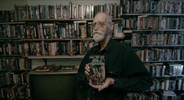 David Huggins displays his collection of sci-fi and horror movies on VHS in Brad Abrahams' Love and Saucers (2017)