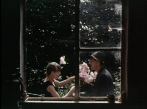 Kath and Jim share a moment in the garden in Philip Trevelyan's The Moon & the Sledgehammer (1971)