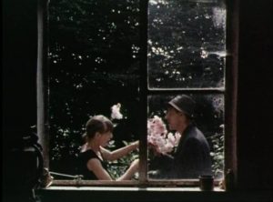 Kath and Jim share a moment in the garden in Philip Trevelyan's The Moon & the Sledgehammer (1971)