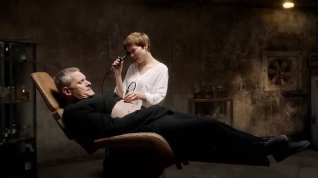 Caprice (Lea Seydoux) examines the new organ growing inside artist Saul Tenser (Viggo Mortensen) in David Cronenberg's Crimes of the Future (2022)