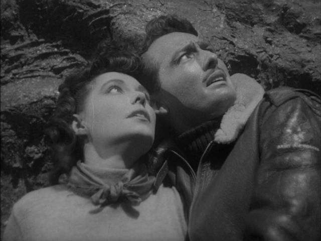 John Lawrence (Robert Clarke) and Enid Elliot (Margaret Field) see something fall from the sky in Edgar G. Ulmer's The Man from Planet X (1951)