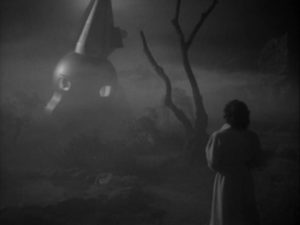 Enid Elliot (Margaret Field) approaches the mysterious craft on a foggy night in Edgar G. Ulmer's The Man from Planet X (1951)
