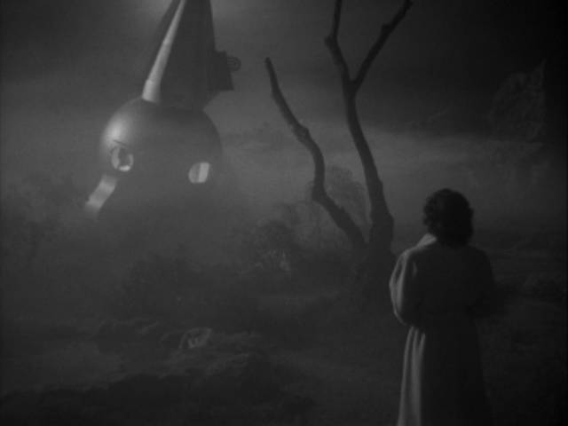 Enid Elliot (Margaret Field) approaches the mysterious craft on a foggy night in Edgar G. Ulmer's The Man from Planet X (1951)